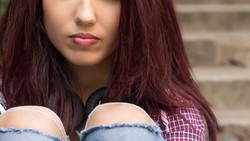 Girl sitting on the stairs