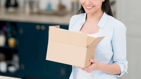 Holding a box in the kitchen compressed