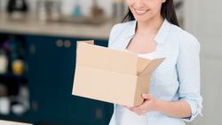 Holding a box in the kitchen compressed