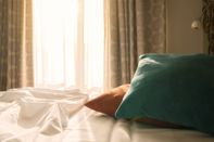 Bed with pillows compressed