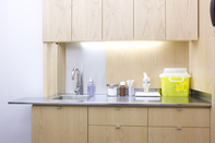 Yellow sharps container